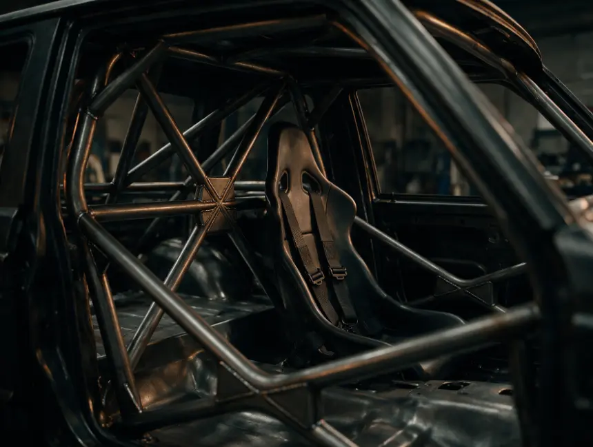 Fully welded multi-point tubular roll cage inside a stripped 4x4